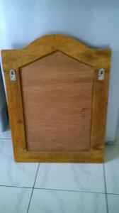 Porte miroir en bois sculpté à deux vantaux